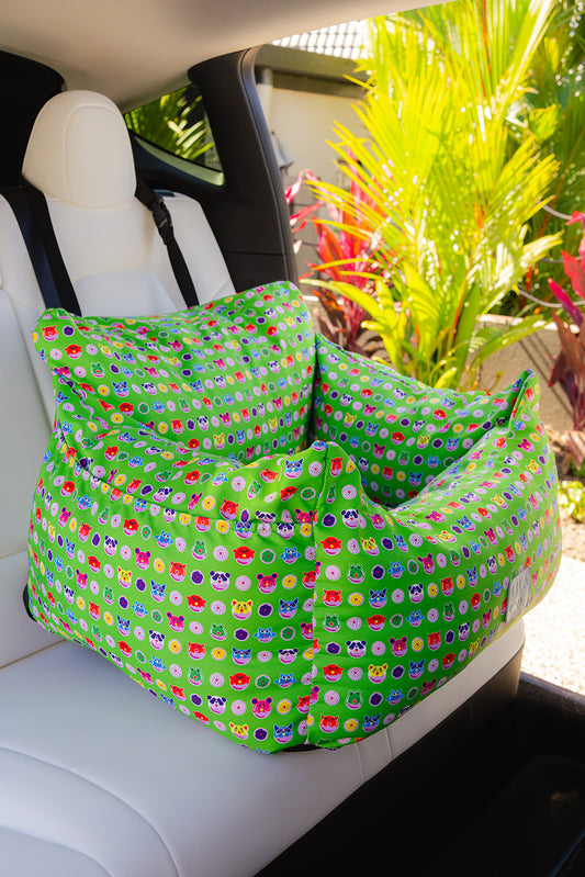 Green donut animals print water resistant dog car seat bed front view in car