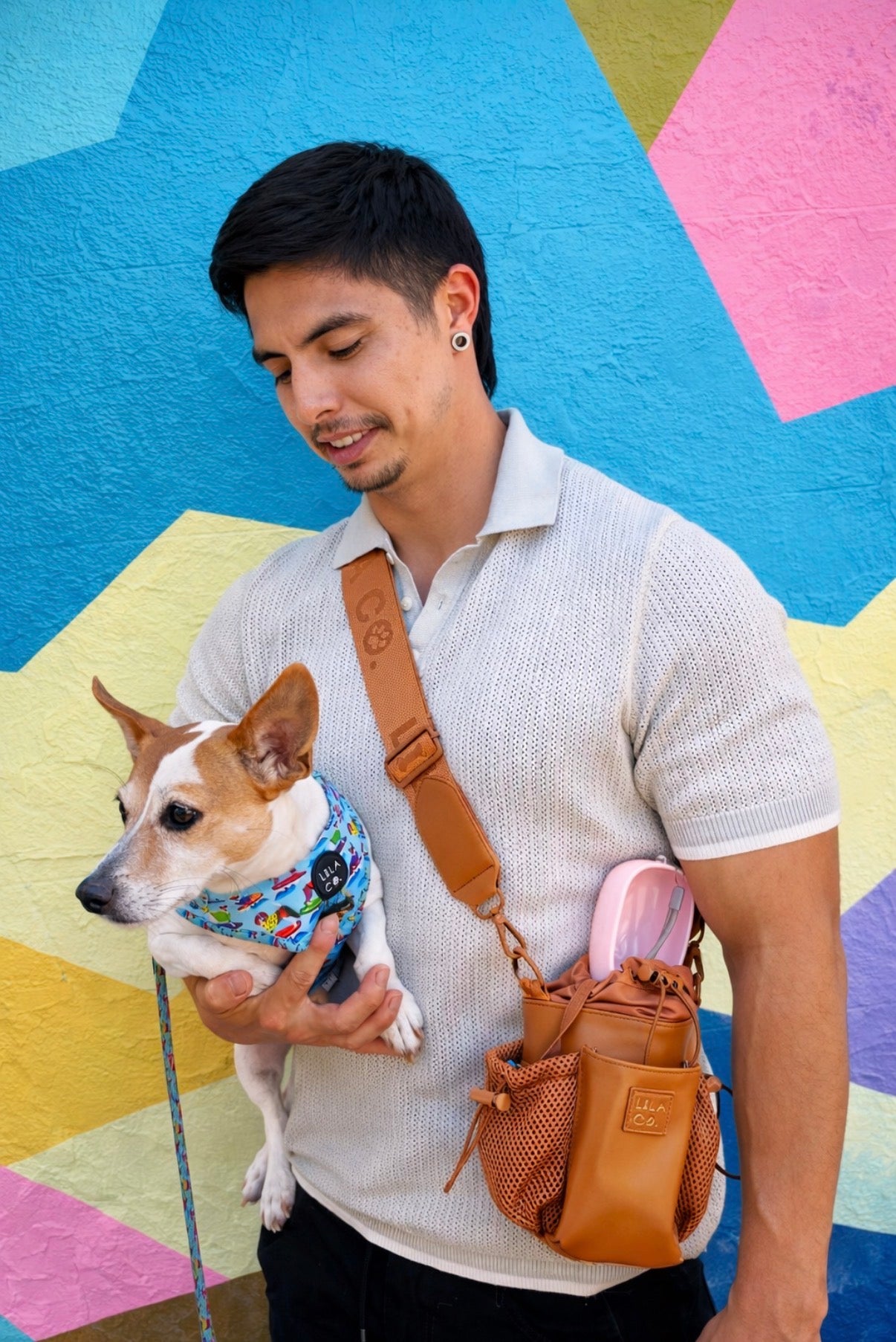 Dog Dad wearing the Lila Co Caramel Dog Walking Bag