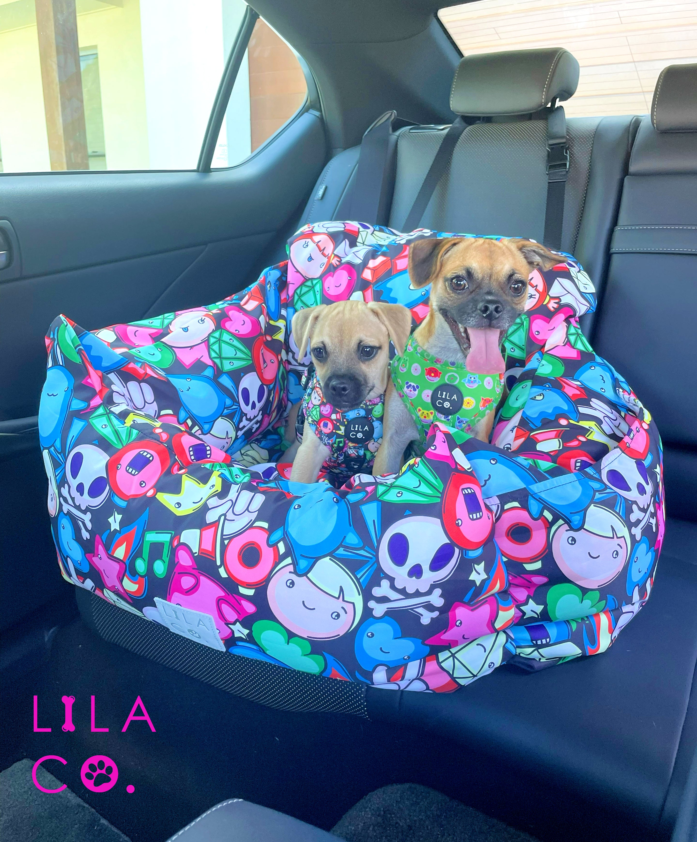 Winter and Chip the Pug x Jack Russell Terriers riding together in black gamer characters print dog car seat bed using double clip extension